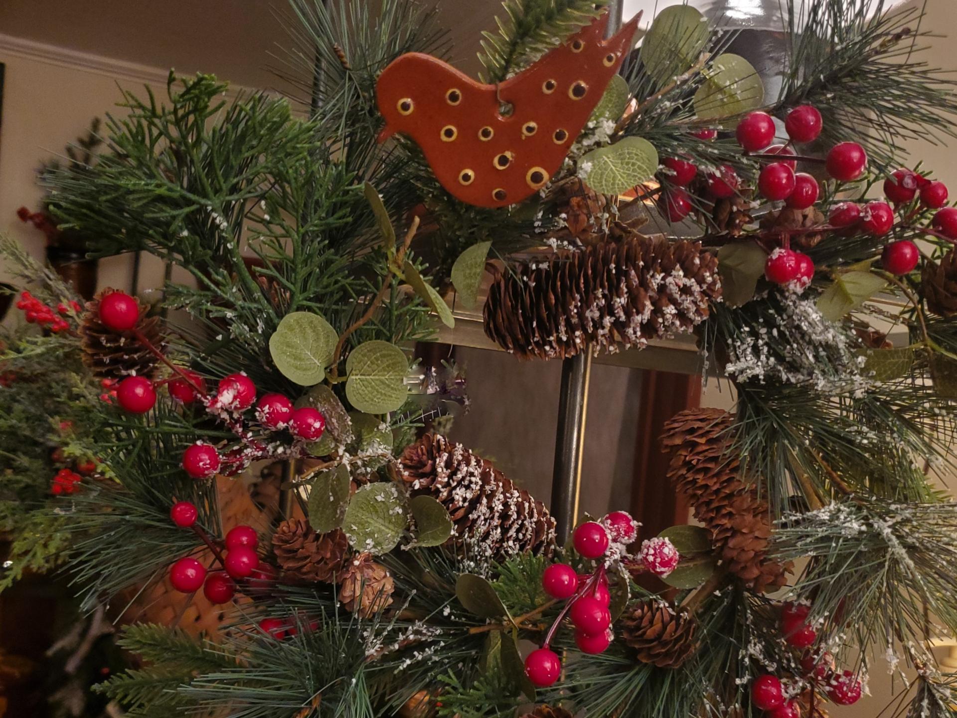 Snowy Pine Wreath with Red Berries and Redware Bird Ornament