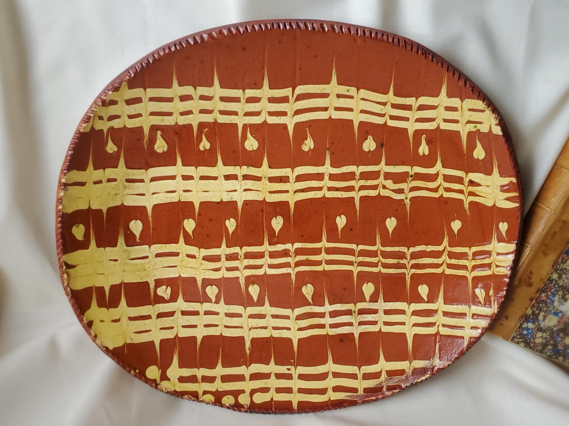 Redware Oval Platter with Feathered Slipware Pattern
