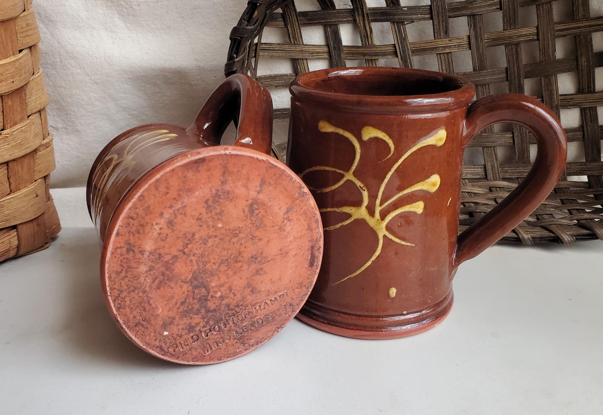 Two Slip-Decorated Redware Mugs with Feather Motif (a)