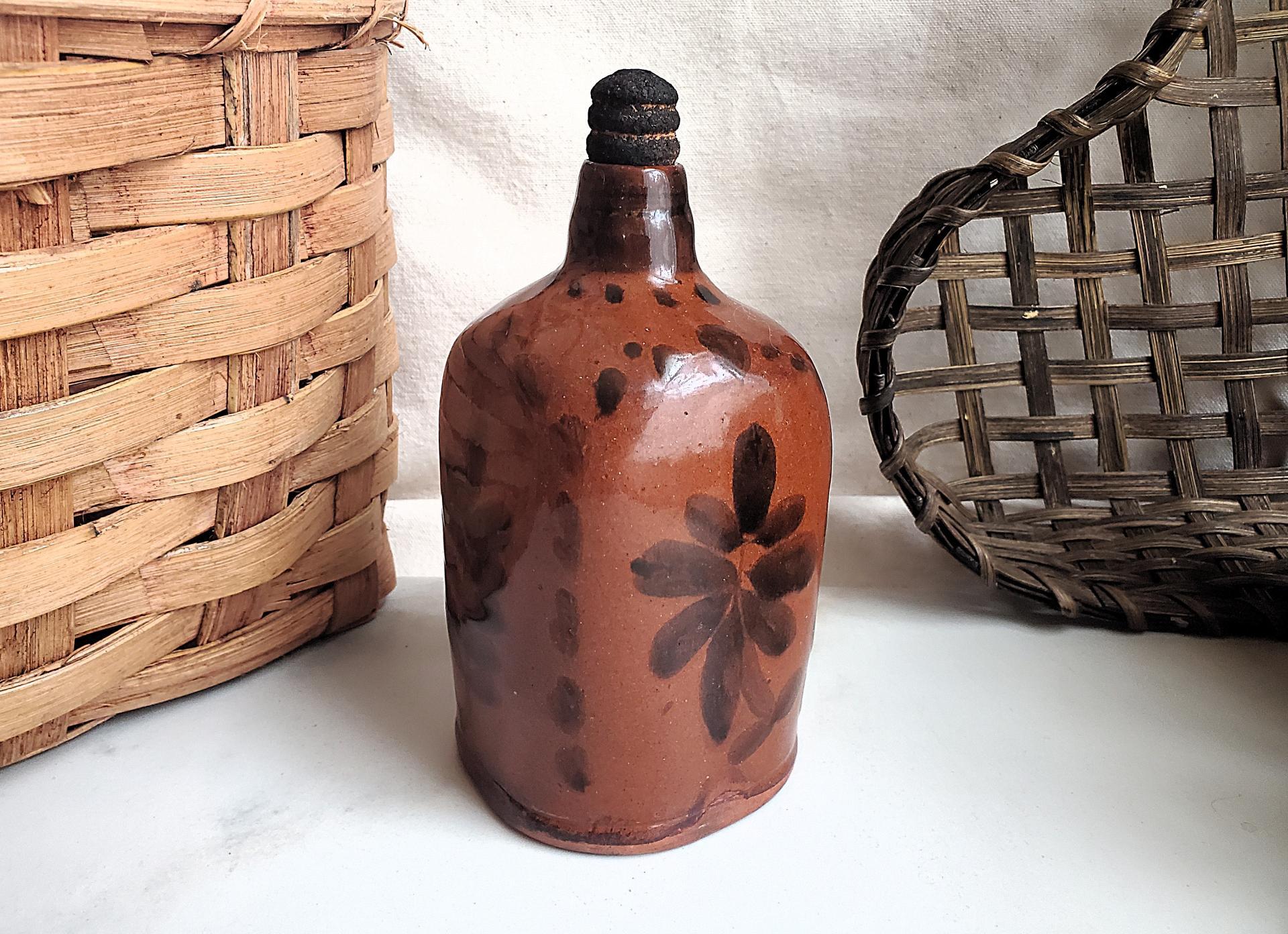 Redware Bottle and Stopper with Black Floral Motif and Square Bottom