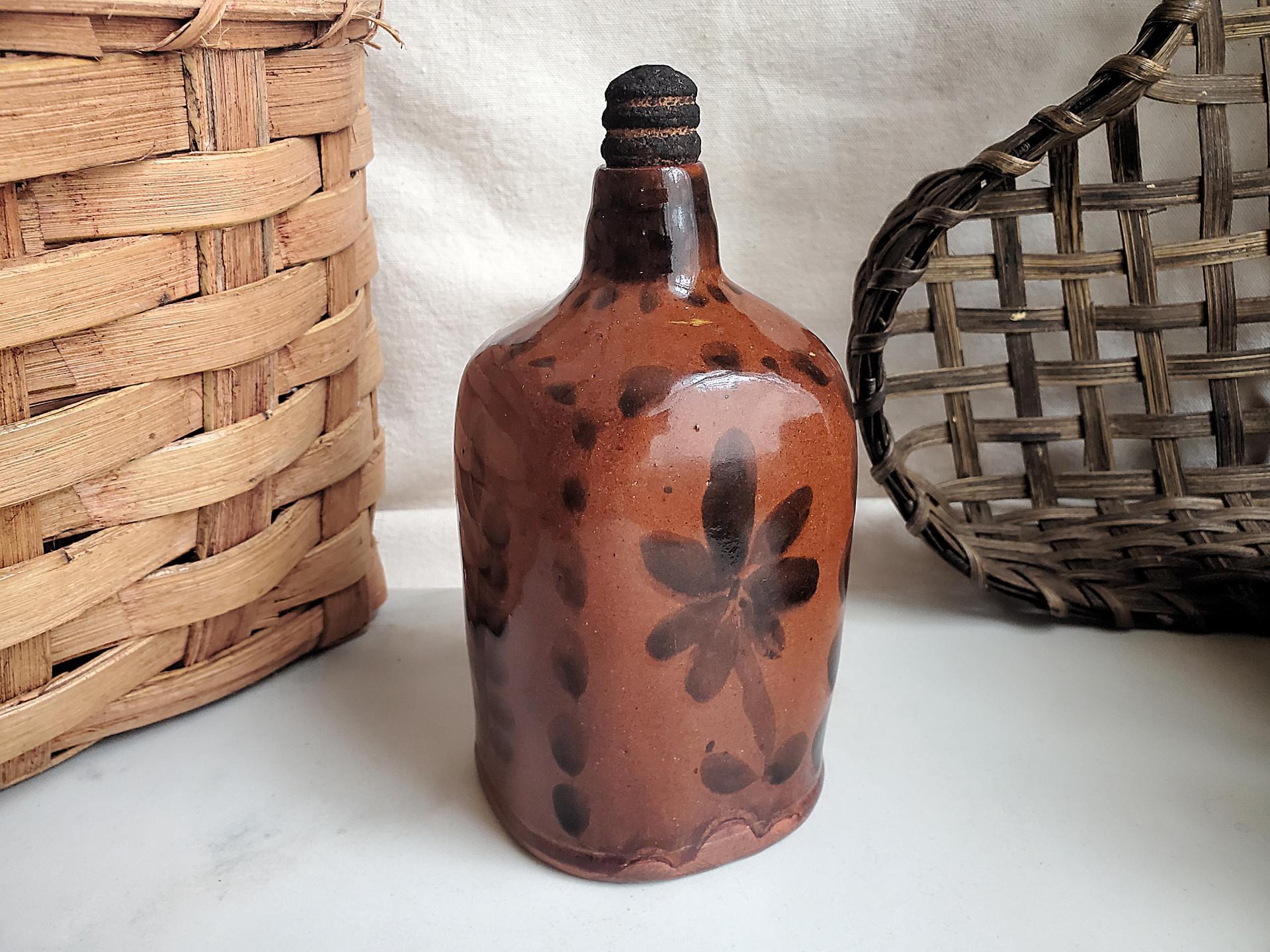 Redware Bottle and Stopper with Black Floral Motif and Square Bottom