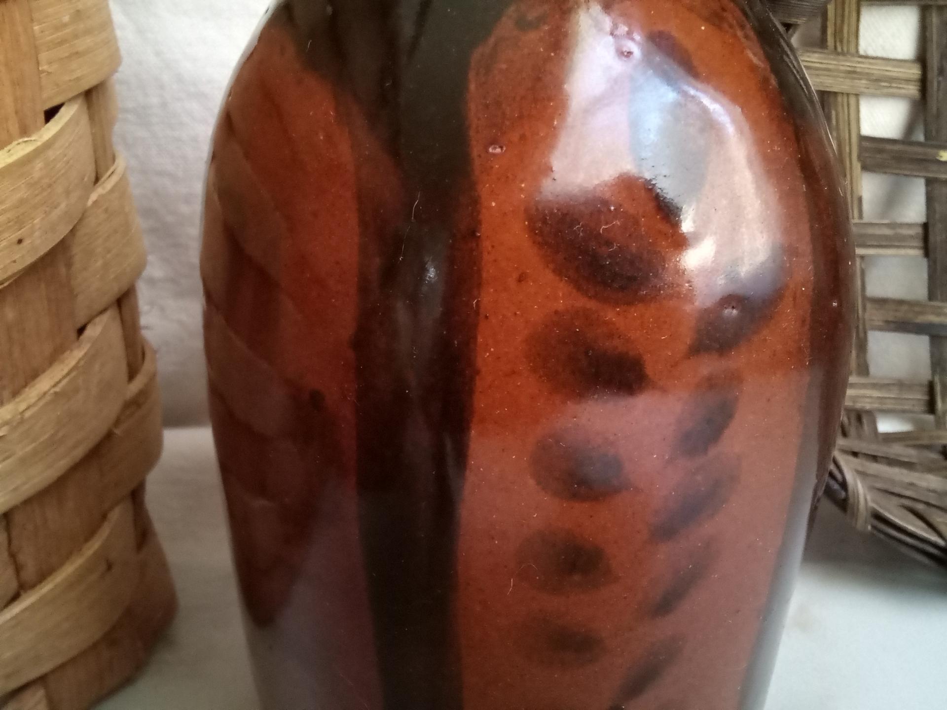 Redware Bottle and Stopper with Black Motif and Square Bottom