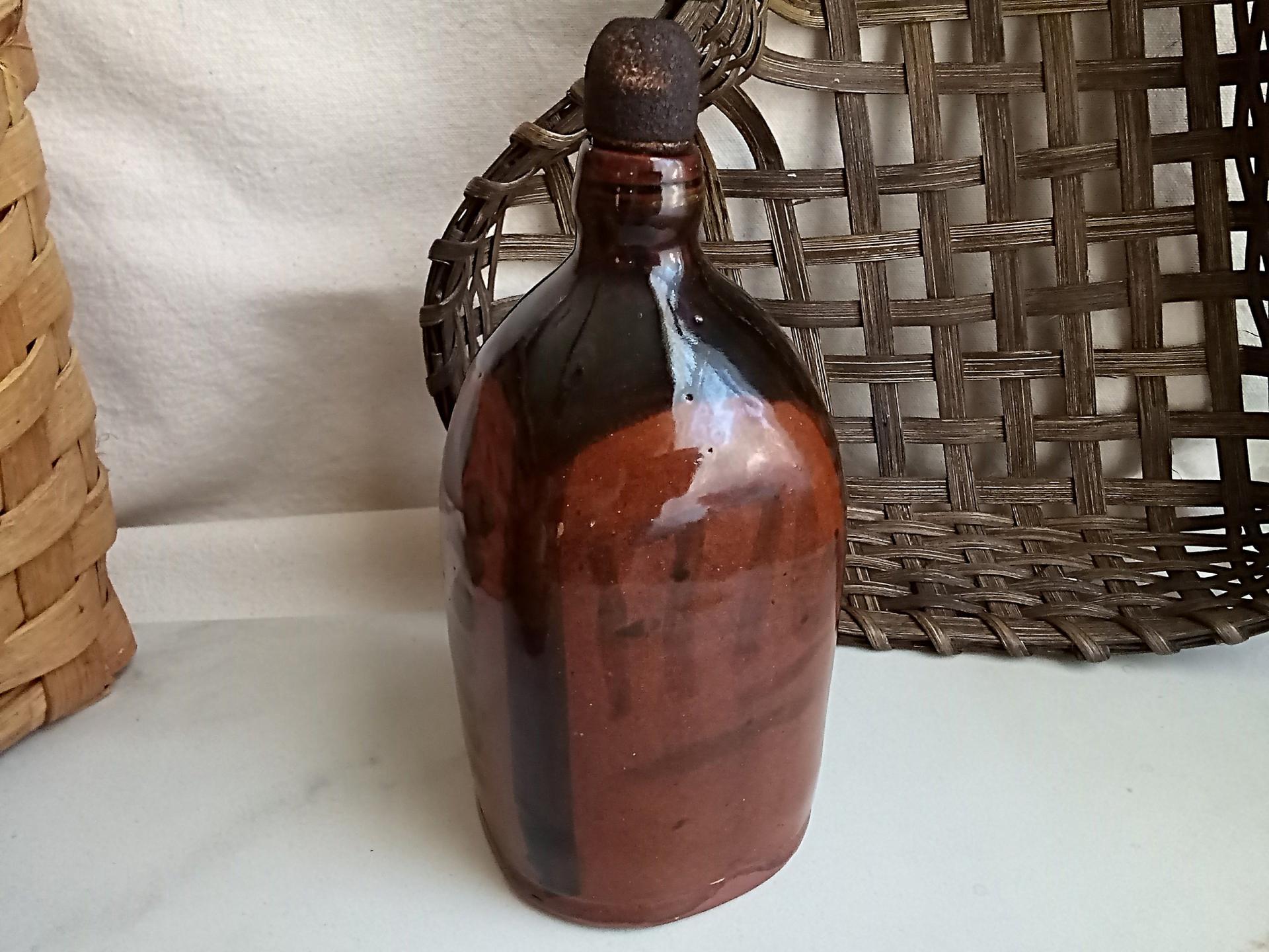 Redware Bottle and Stopper with Black Motif and Square Bottom